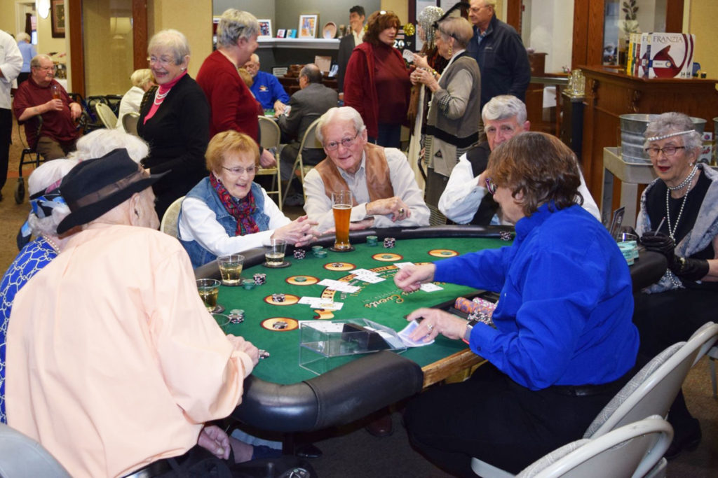 During Casino Night, residents are dressed up and playing Blackjack, drinking and laughing